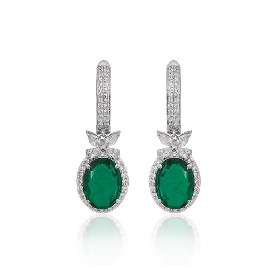 Pair of emerald green gemstone earrings with silver pineapple designs on a white background