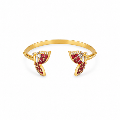 Gold open cuff bangle bracelet with red enamel leaf-shaped end pieces and small clear rhinestone accents, shown on a plain white background.